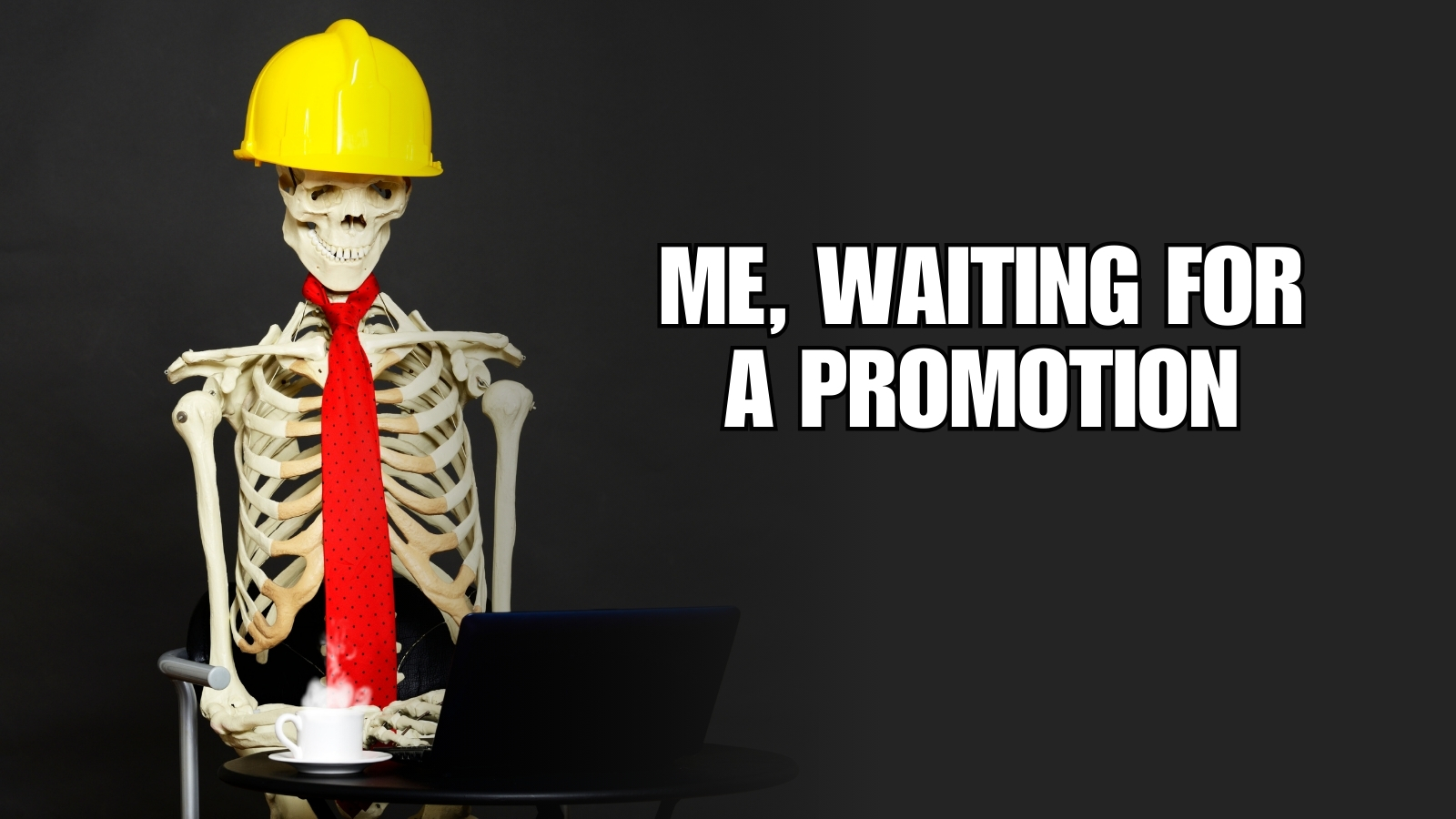 Skeleton in safety hard hat and tie, sitting at a laptop with text that says "Me, waiting for a promotion"